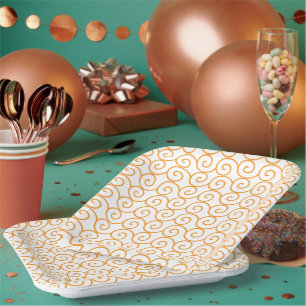 A brown and orange rug with a repeating pattern mo paper plate