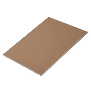 a brown background with a white border notepad