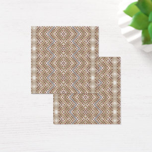 A brown rug displaying a symmetrical design featur