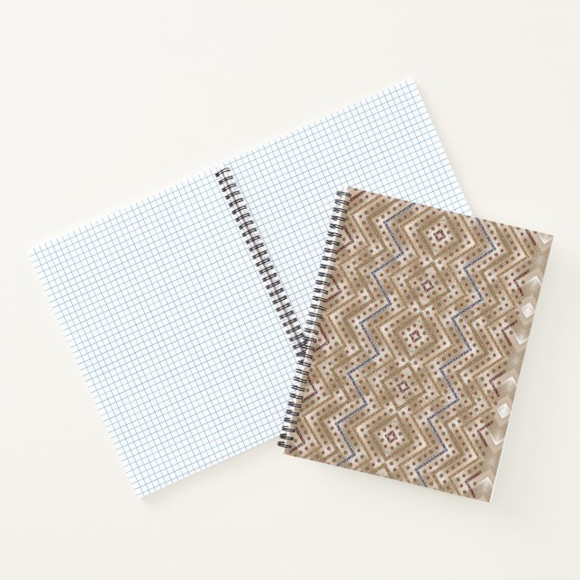 A brown rug displaying a symmetrical design featur notebook (Inside)