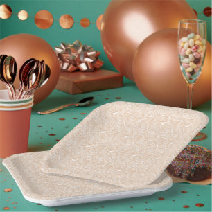 A brown rug with an intricate motif lies on the fl paper plate