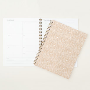 A brown rug with an intricate motif lies on the fl planner