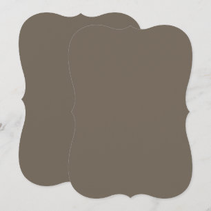 a brown wall with a black and white clock on it