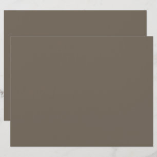 a brown wall with a black and white clock on it custom letterhead