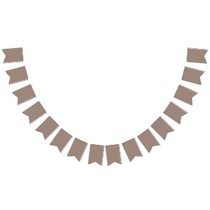 a brown wall with a clock on it bunting