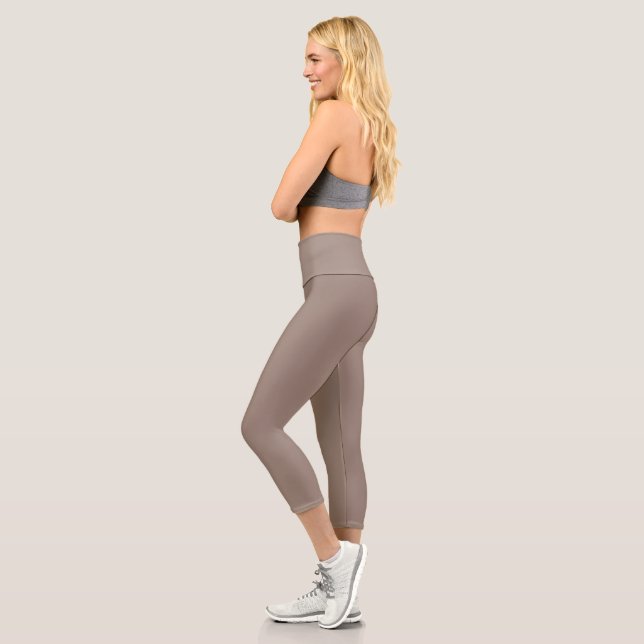 a brown wall with a clock on it capri leggings (Left)