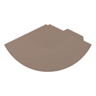 a brown wall with a clock on it party hat