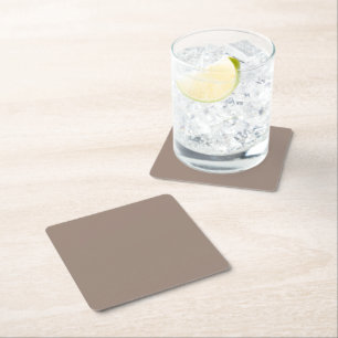 a brown wall with a clock on it square paper coaster