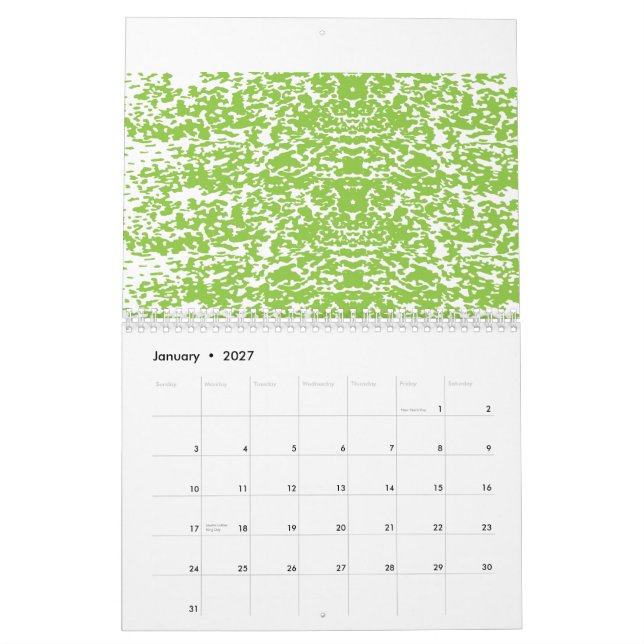 A brown wooden table holds a glass bottle of olive calendar (Jan 2027)