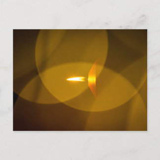 A burning candle postcard