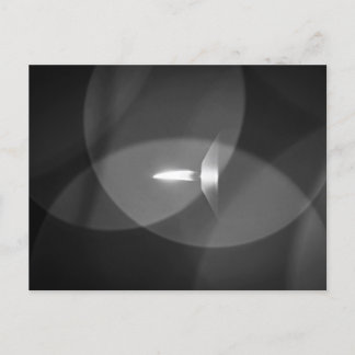 A burning candle postcard