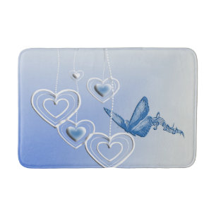 A butterfly and hearts bath mat