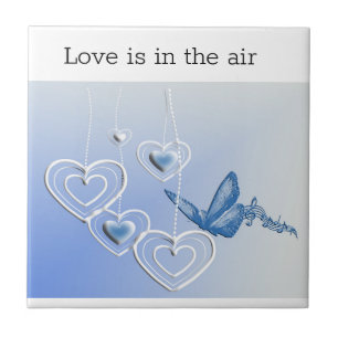 A butterfly and hearts tile
