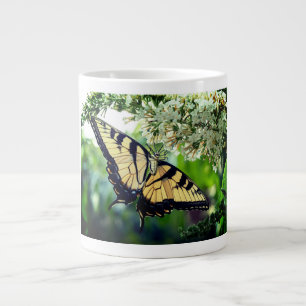 A butterfly with yellow and black wings large coffee mug