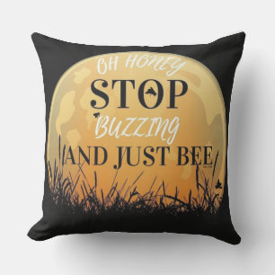 A buzzing black pillow with bee quotes.