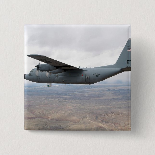 A C-130 Hercules soars through the sky 15 Cm Square Badge (Front)