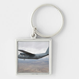 A C-130 Hercules soars through the sky Key Ring