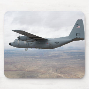 A C-130 Hercules soars through the sky Mouse Mat