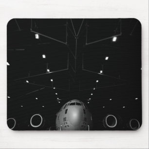 A C-17 Globemaster III sits in a hangar Mouse Mat