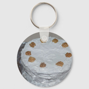 A cake with frosting key ring