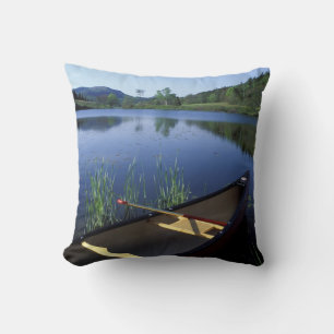 A canoe rests on the shore of Little Long Pond Cushion