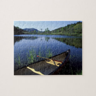 A canoe rests on the shore of Little Long Pond Jigsaw Puzzle