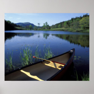 A canoe rests on the shore of Little Long Pond Poster