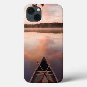 A canoe rests on the shore of Pawtuckaway Lake iPhone 13 Case