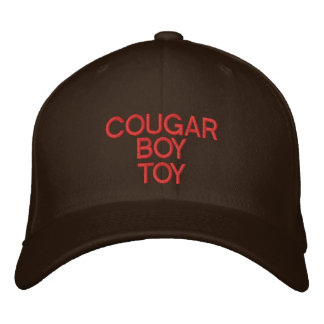 A cap wIth  "COUGAR BOY TOY" On It