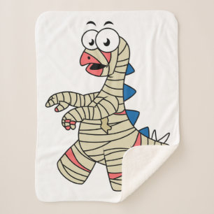 A Cartoon Stegosaurus Dressed Up As A Mummy. Sherpa Blanket