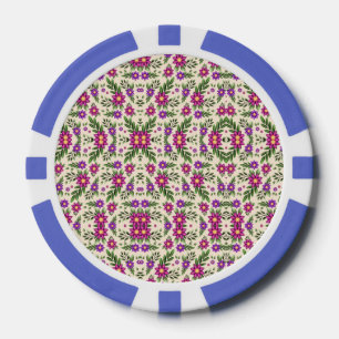 A casino chip features intricate floral patterns