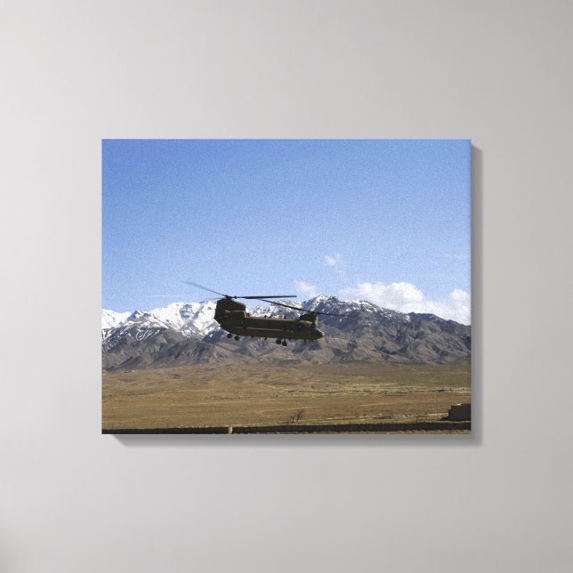 A CH-47 Chinook takes off Canvas Print (Front)