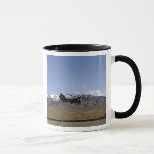 A CH-47 Chinook takes off Mug