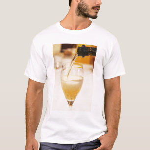 A champagne glass flute being filled with Gosset T-Shirt