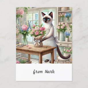 A charming cat carefully arranges beautiful flower holiday postcard