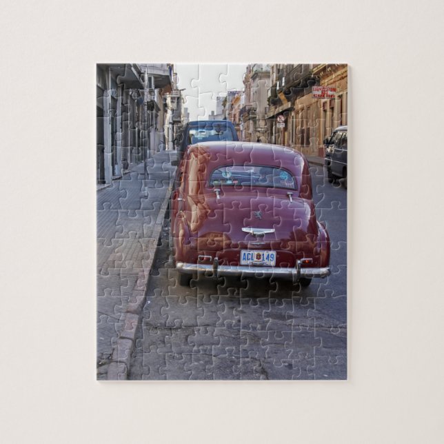 A classic old red Peugeot car parked on a street Jigsaw Puzzle (Vertical)