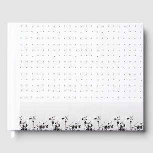 A clean white backdrop featuring tiny dots scatter guest book