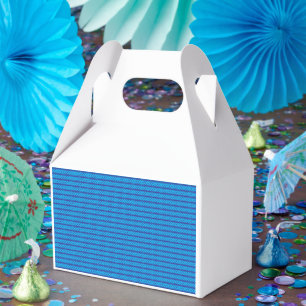 A clear blue sky stretches above a calm, deep blue favour box