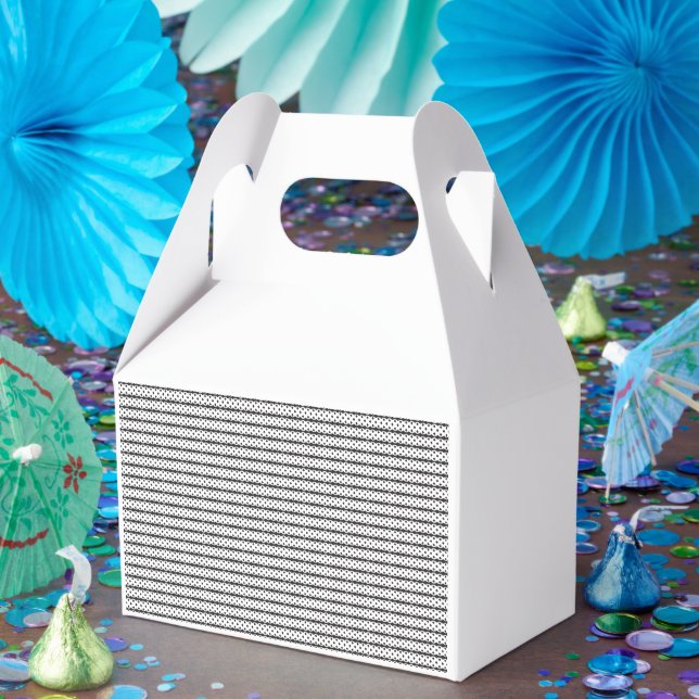A close-up of a fluffy orange and white cat lying  favour box (Party)