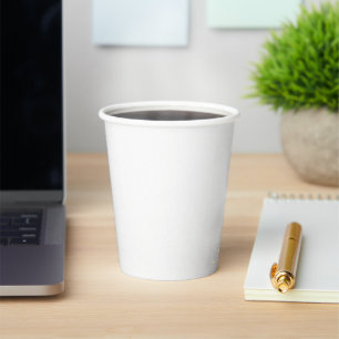 A close-up of a white sleeve made from a smooth, p paper cups