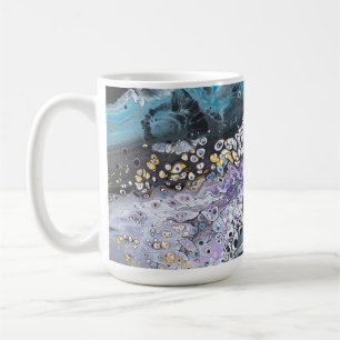 A coffee mug with black and blue original artwork