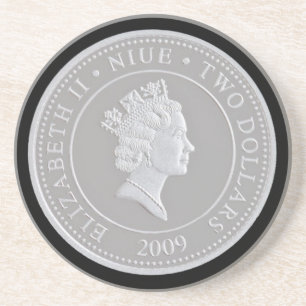 A commemorative silver coin coaster