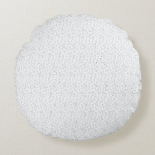 A completely white, featureless surface fills the  round cushion