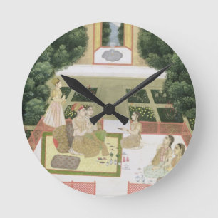 A couple in a garden listening to music with femal round clock