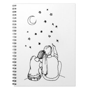 A couple in love sits and counts the stars in the notebook