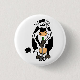 A cow playing golf 3 cm round badge