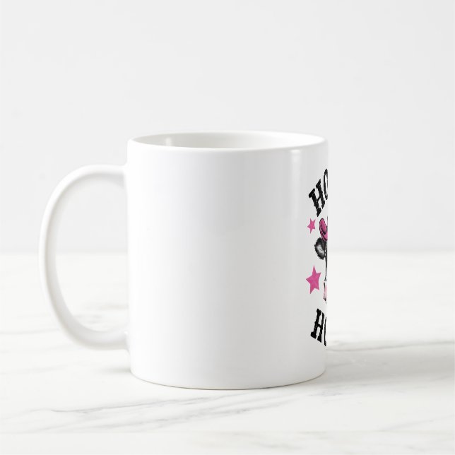 A cow wearing a vibrant pink cowboy coffee mug (Left)