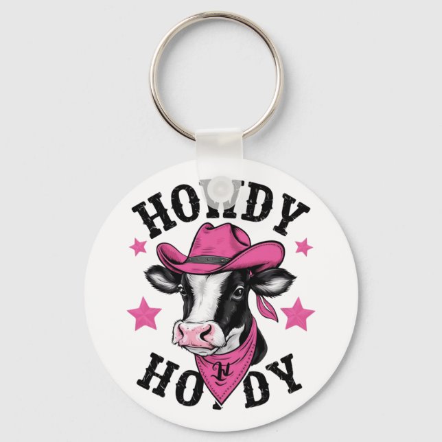 A cow wearing a vibrant pink cowboy key ring (Front)