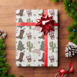 A Cowboy Merry Christmas Wrapping Paper<br><div class="desc">This holiday season, put a smile on someone’s face with this fun and festive cowboy-themed wrapping paper! Featuring a playful and unique Western design, it’s adorned with colourful illustrations of cowboy boots, cacti, horseshoes, Christmas trees, and candy canes — blending holiday cheer with rustic charm. Perfect for gift-giving with a...</div>