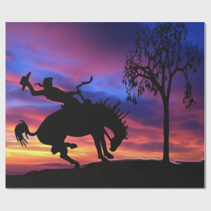 A cowboy silhouette at sunset wrapping paper